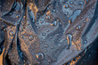 © Robert - Water drops on black plastic