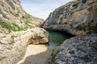 Rocky beach in Ghasri Valley (Wied il Ghasri) - hidden gorge in Gozo, Malta