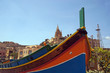 Traditionally painted colorful fishermen's boat in Mgarr, Gozo, Malta
