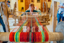 Woman Works With Traditional Hand Weaving Loom