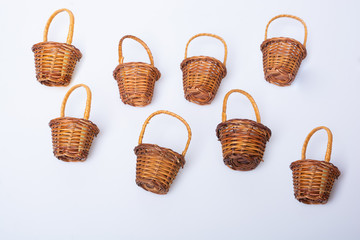 Wall Mural - Empty wicker baskets on a white background