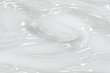 Swirl in milky liquid surface. Closeup. 3D illustration.