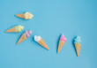 Colorful sweet ice cream cone isolated on blue pastel background ,holiday and relax concept