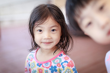 Wall Mural - Portrait of a smiling little cute girl