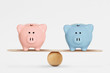 © calypso77 - Pink and blue piggy bank on balance scale - Gender pay equality concept