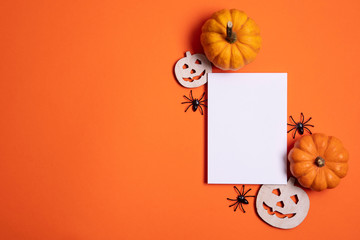 Blank white halloween card with pumpkins and spiders. Poster invitation mockup