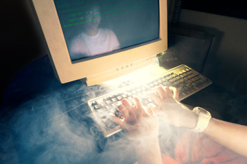 Old personal computer with code in screen