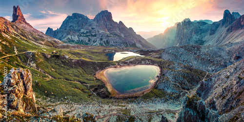 Impressive summer sunrise in rocky mountain valley. Fantastic morning scene of Tre Cime di Lavaredo National park with Laghi del Piani lakes, Dolomiti Alps, South Tyrol, Italy, Europe. © Andrew Mayovskyy
