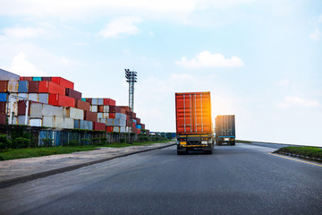 Back view of Red Container truck in ship port Logistics.Transportation industry in port business concept.import,export logistic industrial Transporting Land transport on Port transportation storge 