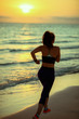 © Alliance - healthy sports woman on seashore in evening running