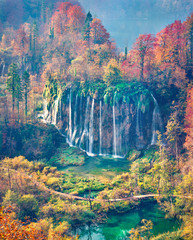 Epic morning view of pure water waterfall in Plitvice National Park. Aerial autumn scene of Croatia, Europe. Abandoned places of Plitvice lakes series. Beauty of nature concept background.