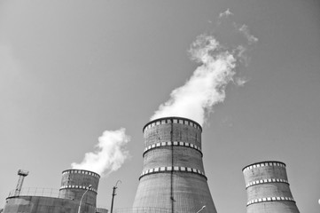 Atomic reactor. Operating nuclear power plant. Smoke from the chimney, black and white. Power Generation