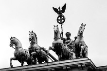 Bronze Quadriga Chariot On Top Of The Brandenburg Gate Tor In Berlin, Germany.