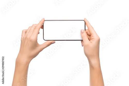 Fotomural Female hands taking photo on smartphone with blank screen