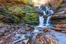 Waterfall Shypot Of Carpathian Mountains In Autumn. Powerful Stream Of Water. Brown Foliage On The Rocks