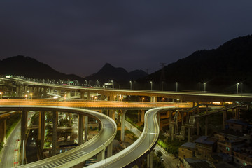 Wall Mural - aerial view of buildings and highway interchange in dawn in Guiyang, China