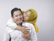 © airdone - Happy Asian Muslim Couple, Wife Kiss Husband