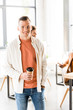 © LIGHTFIELD STUDIOS - young, handsome businessman in casual clothing holding coffee to go and smiling at camera