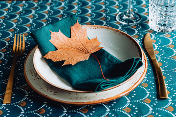 Wall Mural - Festive table place for Thanksgiving dinner with Autumn decor.