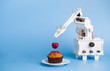 AI assistant preparing cupcake at kitchen, blue background