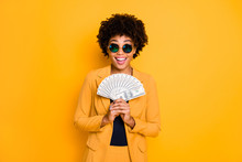 Portrait Of Excited Afro American Lady Freelancer Hold Money Fan Get Salary Profit Income Scream Wow Omg Wear Style Fashion Jacket Suit Isolated Over Yellow Color Background