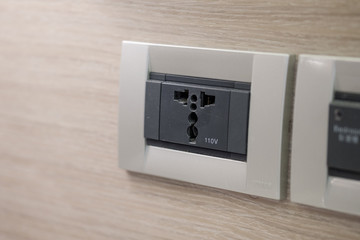 110v Universal Wall Socket in a hotel room.