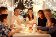 © Syda Productions - celebration, holidays and people concept - happy family with sparklers having tea party at home