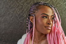 Portrait Of Young Woman With Pink Braids