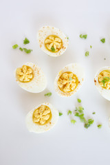 Wall Mural - Deviled Eggs on White Background