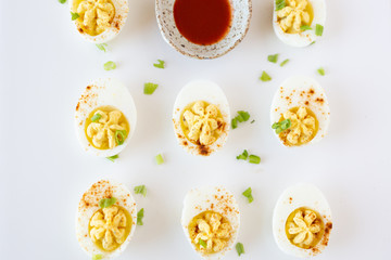 Wall Mural - Deviled Eggs on White Background