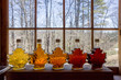 Various Grades Of Delicious Vermont Maple Syrup Lined Up On A Windowsill