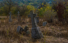 Old Stone Cross Grave Markers On Abandoned Cemetery