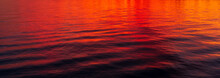 Reflections Of A Beautiful Orange Sunset On Water