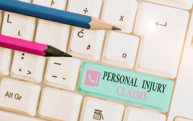 Word writing text Personal Injury Claims. Business photo showcasing being hurt or injured inside work environment White pc keyboard with empty note paper above white background key copy space