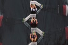 Blurred Motion Overhead View Of A Rowing Crew In A Sculling Boat On The Water, Mid Stroke,Lake Union