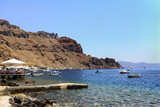 Fototapeta Big Ben - Boats moored along the coast of the Greek island of Thirassia