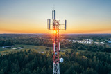 Mobile communication tower during sunset from above.