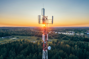 Mobile communication tower during sunset from above.