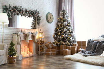 stylish interior of living room with decorated christmas tree