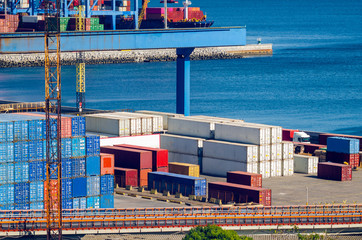 Stacked cargo containers in storage area of freight sea port