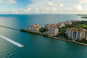 Wall Mural - Aerial drone photo of a speed boat passing by Fisher Island Miami Beach FL