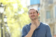 © Antonioguillem - Stressed man suffering throat ache in the street
