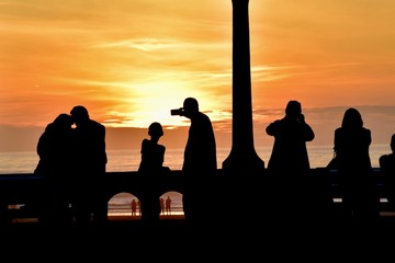 Wall Mural - Silhouettes watching sunset- Seaside, Oregon 4