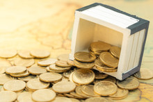 Gold Coins In Opened Treasure Chest On Ancient Map. For Business Achievement Concept.