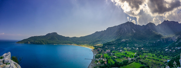 Wall Mural - Panoramic view from Marmaris, Kumlubuk beach, sea and mountain. Holiday and summer background.