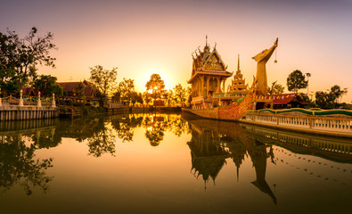 Panorama A huge Thai Suphannahong, also called Golden Swan or Phoenix boat at the WatpahSuphannahong Temple twilight time in sisaket, Thailand.Warm tone concept.