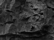 © Наталья Босяк - Rock texture. Dark black grunge stone texture background. Fragment of a mountain close-up.