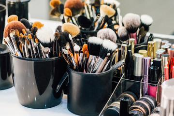 Wall Mural - Professional set of make-up brushes ready to work. Cosmetic Close-up brush, powder, set of different objects for makeup artist and cosmetics