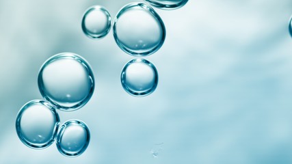 transparent gas bubbles on water surface. worms-eye low angle with crystal bubbles in purified water