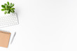 © One Pixel Studio - Modern workspace with keyboard, notebook, pen and small flower. Office desktop concept with copyspace